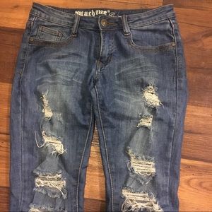 Distressed medium wash low rise denim